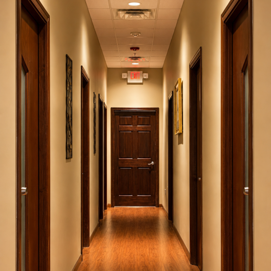Warmly Lit Corridor in Massage Spa with Wooden Doors