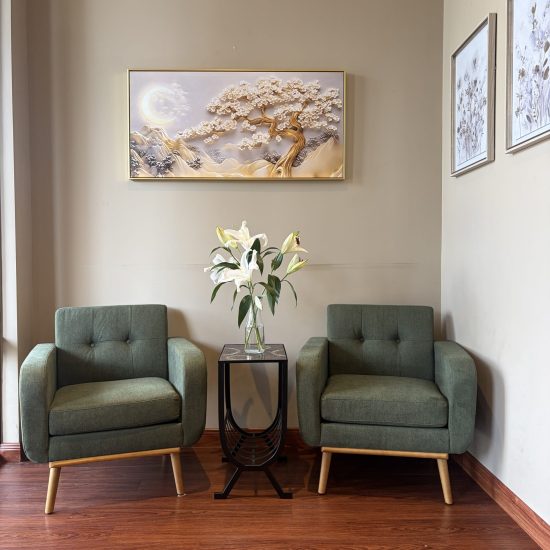 Two Green Armchairs and Floral Decor in Massage Spa Waiting Area